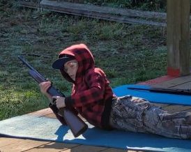 scout_bb_gun Boy reloading a BB gun.
