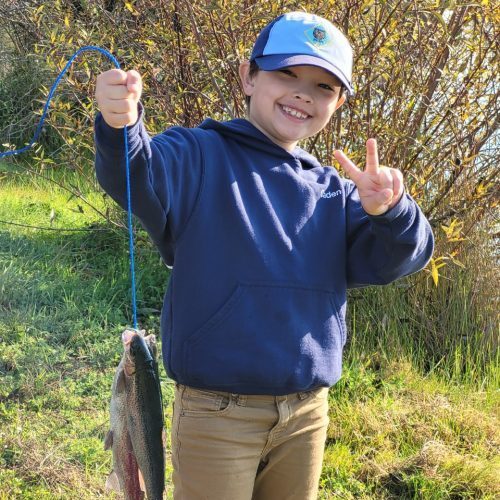 scout_fish_display Boy showing his catch of fish.